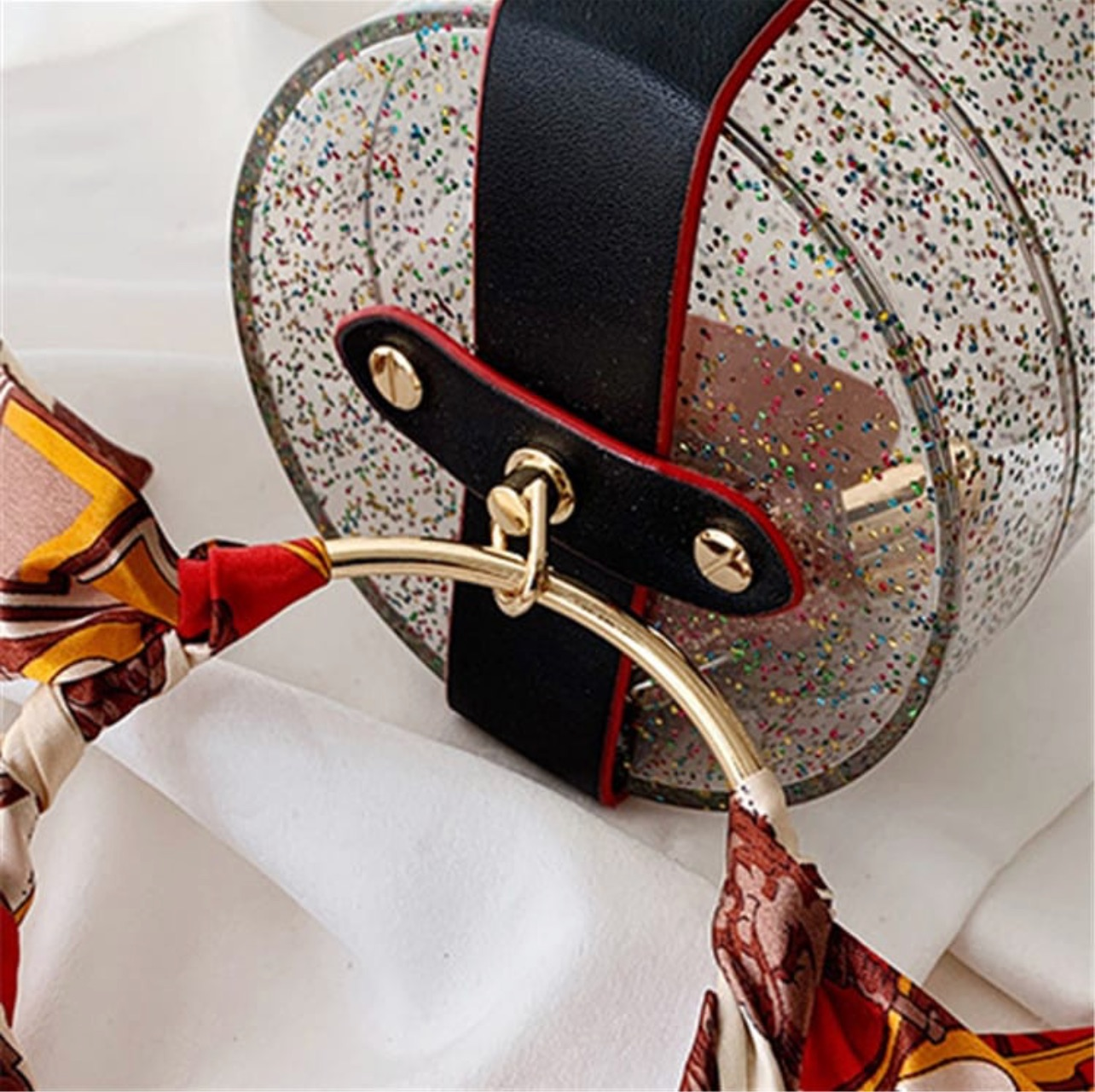 Glittery cylinder wristlet