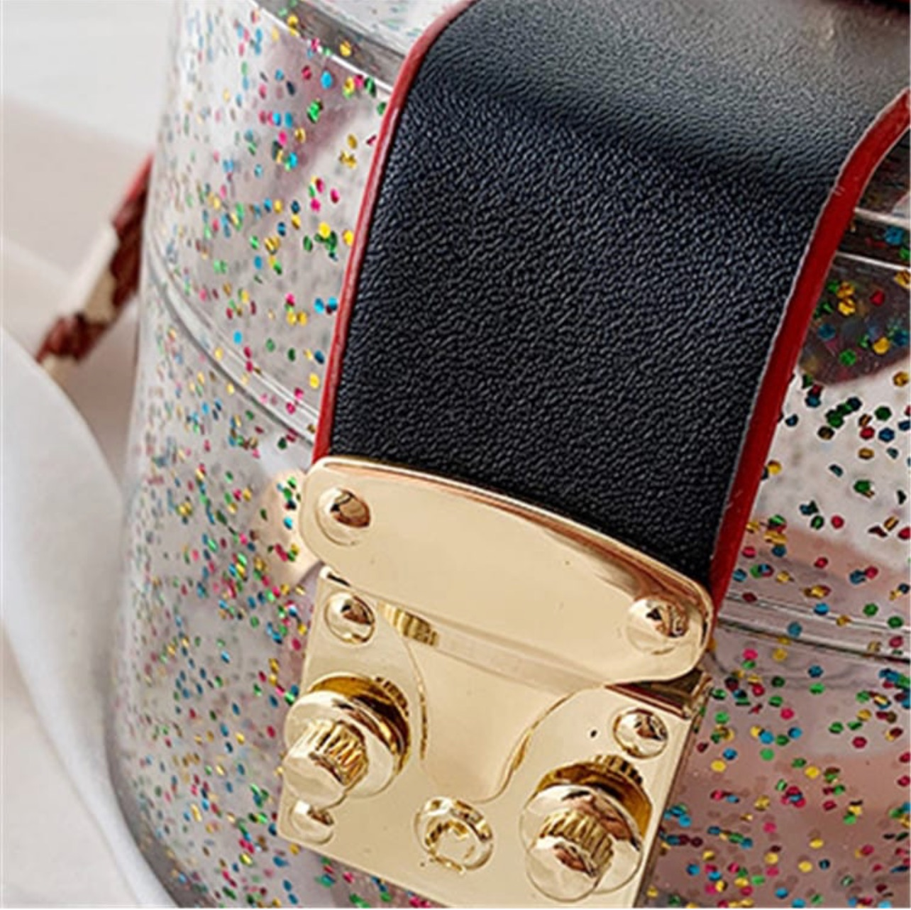 Glittery cylinder wristlet