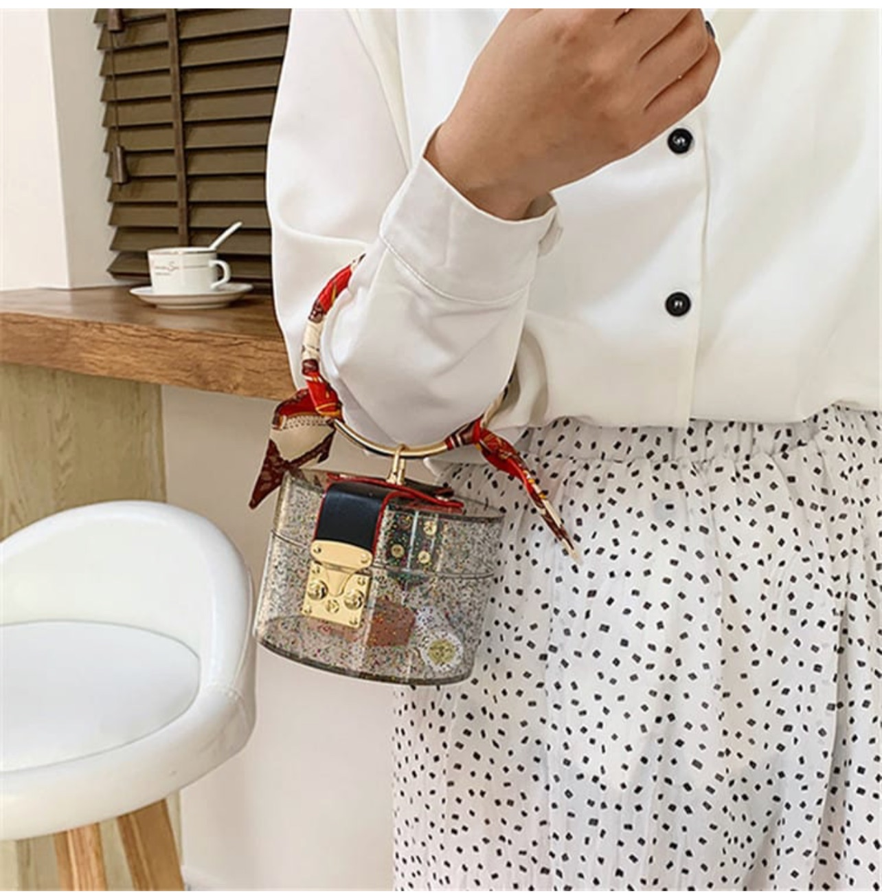 Glittery cylinder wristlet