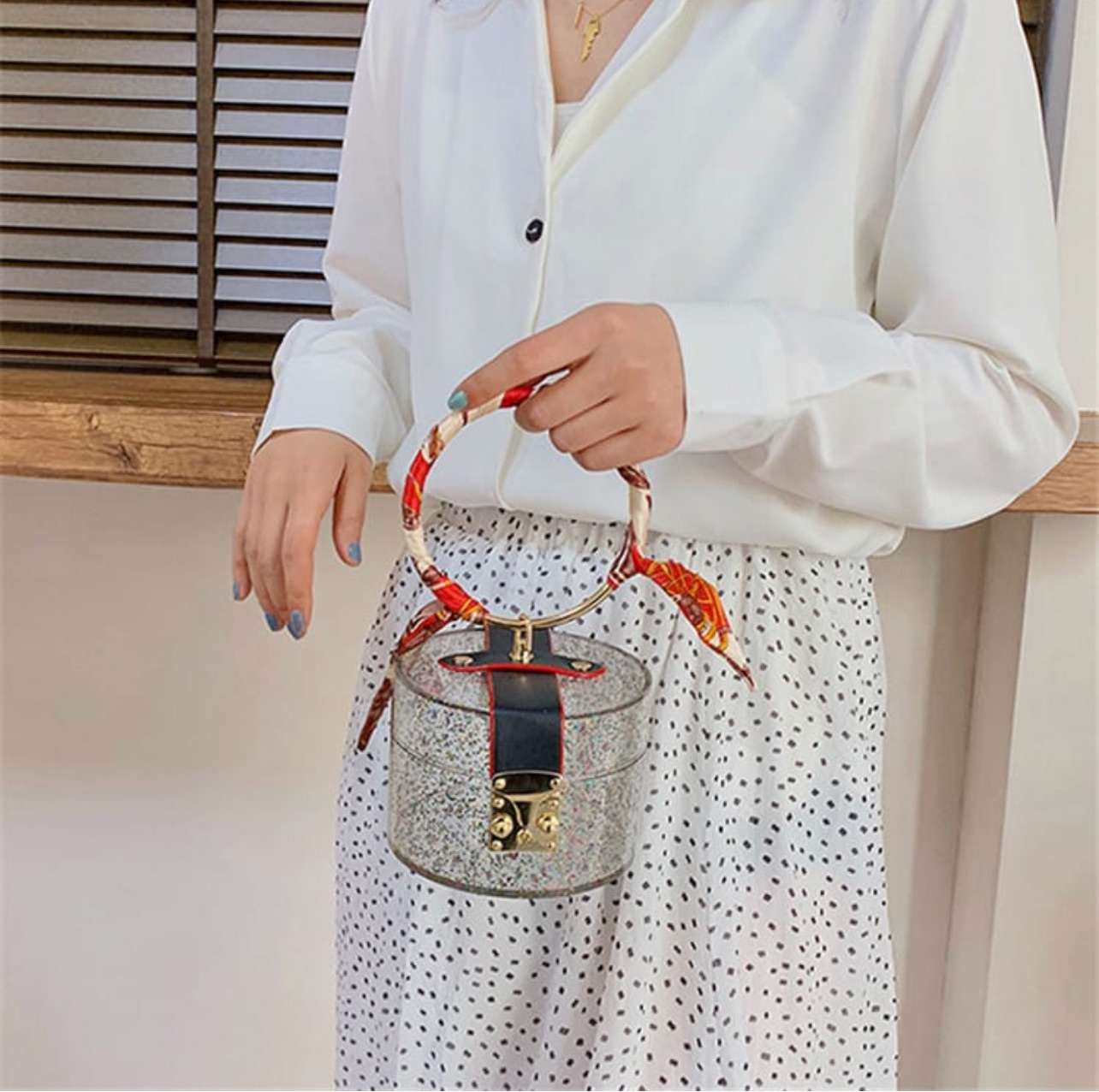 Glittery cylinder wristlet