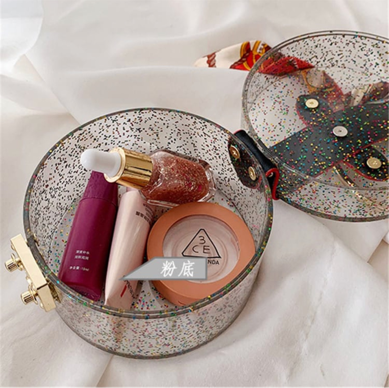 Glittery cylinder wristlet