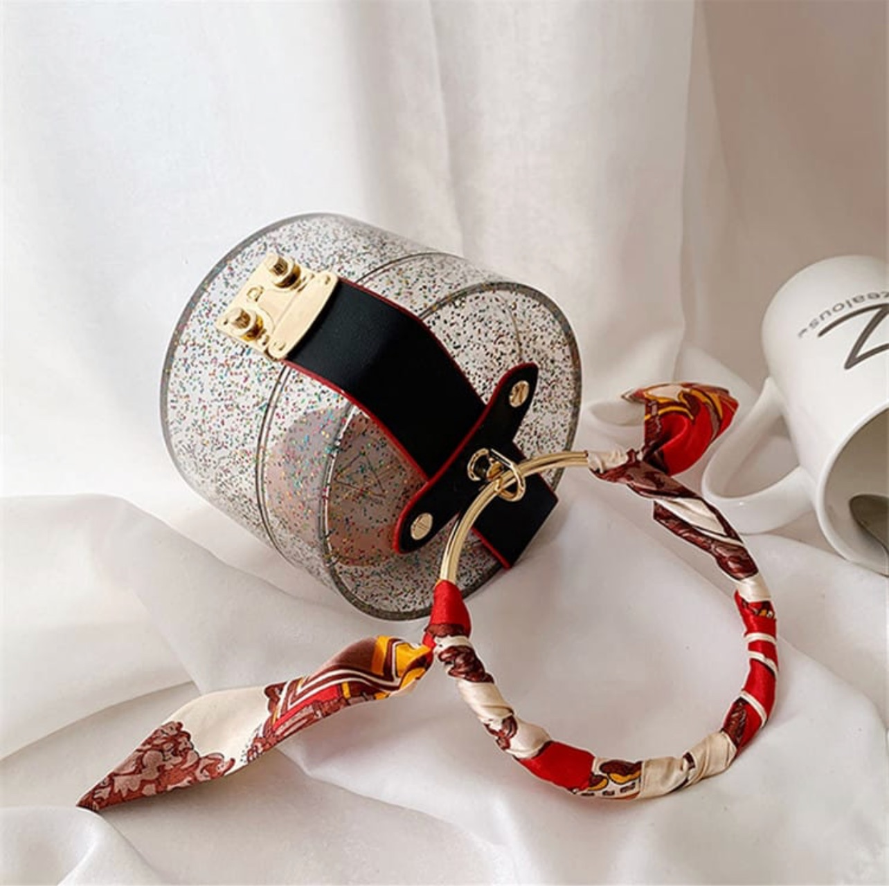 Glittery cylinder wristlet